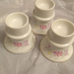 Three porcelain candle holders
